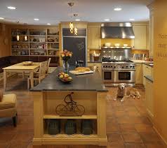 Oak is widely available in stock kitchen cabinetry, which allows for much less expensive kitchen renovation. 20 Interiors That Embrace The Warm Rustic Beauty Of Terracotta Tiles