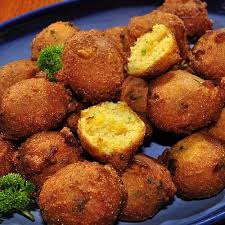 Drop the batter by teaspoonfuls into the hot fat and fry until golden brown. How To Make Hush Puppies The Greatest Fried Food Of All Time Recipes Hush Puppies Recipe Food
