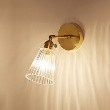 Adjustable wall sconces add even more design flexibility and can essentially replace several fixtures with one compact wall light. Ribbed Glass Tapered Wall Lamp Retro Style Rotatable Small 1 Light Wall Lighting In Brass For Bedside Takeluckhome Com