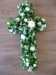 Garden elegance casket spray funeral flowers A Classic Cross Shape In White Flowers White Flowers Funeral Flowers Flowers