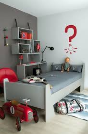 The fun room includes playful furniture and an assortment of toys to keep the children occupied. Box Bookcases Red Boys Bedroom Boy Room Red Cool Kids Bedrooms