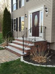 Staircase and staircase cable railing, deck railing and garden fence, horizontal and vertical, straight cable guardrail. Wrought Iron Railings Granite Steps Cranberry Door With Sidelights Brick Porch Outdoor Stair Railing Porch Railing