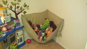 Happy family with little son and kitten sitting on sand with hammock behind at countryside. Pin By Heather Johnson On For The Home Stuffed Animal Storage Stuffed Animal Hammock Organization Kids