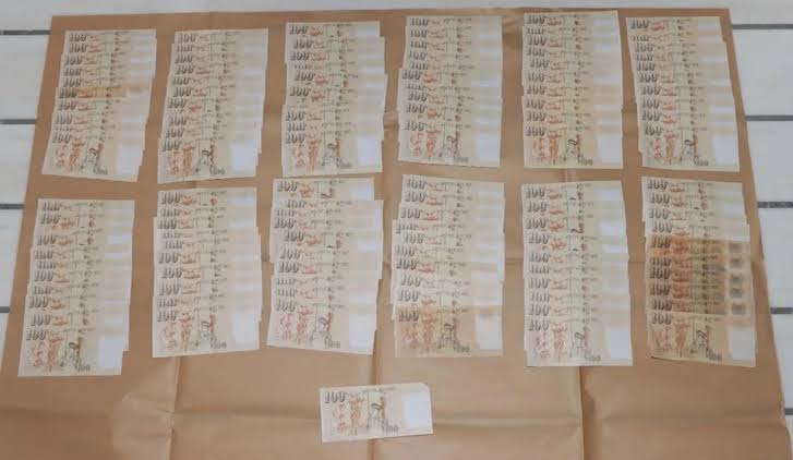 Two Chinese nationals to be charged for counterfeiting Singapore currency notes after police find 121 fake $100 bills at Marina Bay Sands