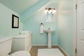 A white half bathroom ideas with proper lighting system to create space illusion; 8 Ideas For Half Bathroom Design
