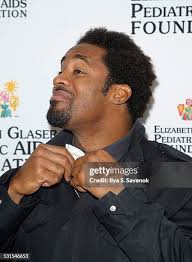 Former professional football player Dhani Jones, and professional... News  Photo