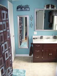 A translucent shower curtain surrounds the freestanding white bathtub creating a functional shower. Bathroom Update On A Budget Bathroom Redecorating Mirrored Bathroom Accessories Decorating Bathroom