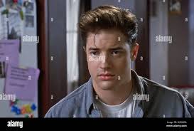 USA. Brendan Fraser in a scene from (C)Warner Bros film : With Honors  (1994). Plot: Convinced his thesis will have him graduate with honors from  Harvard University, a stuffy student finds himself