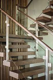 Floating Wood Stair Treads And Acrylic Panels With Wood Hand Rails Mix Materials As An Architectural Feature In Th Staircase Design Stairs Design Modern Stairs