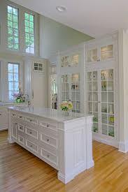 The Natural Window Light Reflects Beautifully Off Of The White Cabinets Creating An Open And Inviting Kitchen Space Kitchen White Cabinets White Kitchen