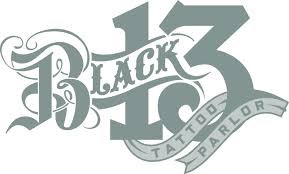 Outline sign for tattoo parlor. Black 13 Tattoo Parlor Nashville Tn