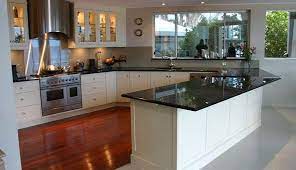 Our grey laminate worktops are available in a variety of textures including roche, granite, linimat, extramatt, supermatt, soft, matt and gloss. Black Granite Benchtops With White Shaker Cabinets Pretty Skirting Board Kitchen Tops Kitchen Worktop White Shaker Cabinets