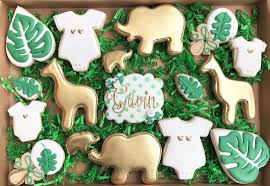 Cookies iced in glaze icing. Image May Contain Dessert And Food Safari Baby Shower Cake Safari Baby Shower Boy Jungle Safari Baby Shower