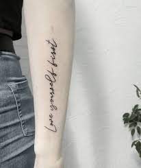 Before you can love anyone else, you must love yourself. Words Love Yourself First Inked In A Handwritten Font On The Left Forearm Love Yourself Tattoo Tattoos Love Tattoos