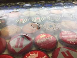Hi, i just finished a bottle cap coffee table. This Uneven Bottle Cap Table Top Crappydesign