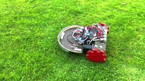 The battery and controller box are temporarily attached to the mower with bungee cords. Diy Robot Lawn Mower Youtube Diy Robot Robotic Lawn Mower Lawn Mower
