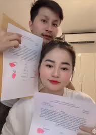 Mai Thoj and Cai are now officially divorced. As part of the separation,  Mai gave her ex-husband, Cai, 100 million (it's unclear if this is in kips  or dongs), equivalent to about
