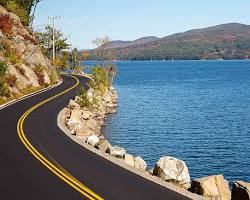 Image of car driving on a scenic road in Vermont