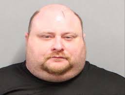 Suspected drunk driver charged after driving into trees, spitting