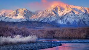 Snowy Mountains Wallpapers Wallpaper Cave Scenic view of snowy mountains with pine trees in white fluffy clouds. snowy mountains wallpapers wallpaper cave