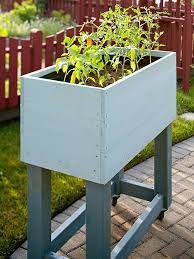 Building a raised garden bed on wheels. 7 Steps To Building A Garden On Wheels Building A Raised Garden Raised Garden Beds Garden Beds