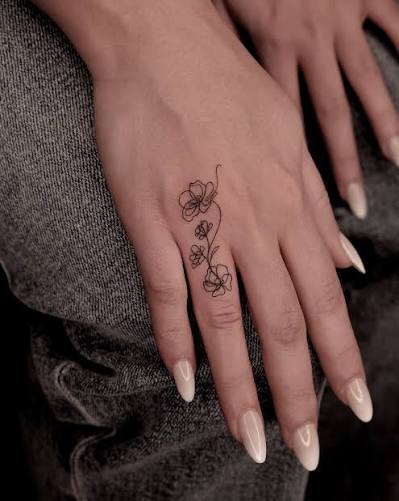 FINE LINE TATTOO STUDIO, NYC | Miniature Tangled Line Flowers on finger, thinnest lines Inquiries & Booking: LINK IN BIO _ #nyctattoo #nycfinelinetattoo... | Instagram