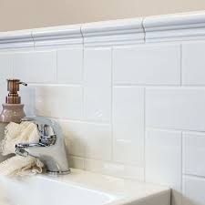 Using a level, draw a line at uniform height across the wall. Chelsea White 150x50 Border Tiles Chelsea Border Tiles 150x50x6mm Tiles Bathroom Border Tiles Border Tiles Bathroom Tile Designs