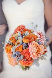 They bloom on top of dark green leaves. Gorg Textures Orange Wedding Flowers Wedding Bouquets Beautiful Wedding Flowers