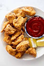 Chicken nuggets are not only are a staple at fast food joints but in the frozen aisle of every grocery store and in various shapes from boots to dinosaurs! Homemade Chicken Nuggets Simply Delicious