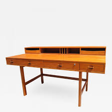 So i built him this desk with a flip up top and a pull out drawer that will hide the keyboard when he's not using it and it will open up when he's ready to practice. Peter Lovig Nielsen Mid Century Teak Flip Top Desk By Peter Lovig Nielsen