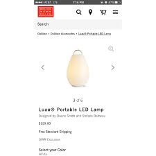 The luau can be on while it's charging and lights up automatically when lifted from the base. Design Within Reach Oxo Candela Lamp Aptdeco