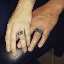 25 Wedding Ring Finger Tattoos To Swoon Over Wedding Ring Finger Tattoos Tattoo Wedding Rings Ring Tattoo Designs