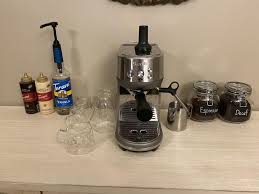 As soon as the light comes on, press and hold the button from the side. The Bambino Espresso Machine Breville