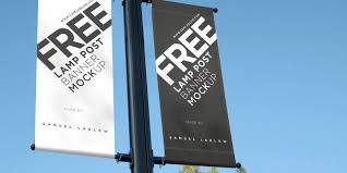 It is attached to a lamp post on a clear day. Free Lamp Post Banner Mockup Bypeople