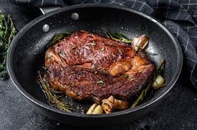 For best results, use only a small quantity of oil or butter. Premium Photo Grilled Rib Eye Ribeye Steak On A Chopping Board Medium Rare Marbled Meat Top View