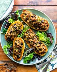 Stuffed Delicata Squash Here S A Delicious Way To Enjoy Delicata Squash Stuffed With A Bread And Saus In 2020 Vegetable Entrees Squash Recipes Meatless Main Dishes