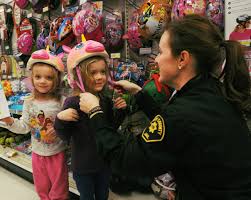 Correction Officer Abby Brend With The Story County Jail Puts Helmets On Twin Sisters Zoey Left And Emma Banks Duri Morning Shopping Emma Banks County Jail