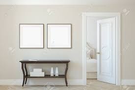 Vignette scene with shelf in front of blue wall and empty black and white picture frame. Interior And Frame Mockup Console Table Near Beige Wall Two Stock Photo Picture And Royalty Free Image Image 118411804