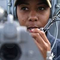 Operations Specialist 3rd Class Jorge Bernal, from Monahans, Texas, stands  port lookout watch