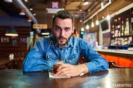 Want to discover art related to puffynipples? Portrait Of Drunk Young Man Looking At Camera With Red Puffy Eyes Sitting At Table In Pub With Glass Of Alcohol Buy This Stock Photo And Explore Similar Images At Adobe