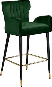 The understated modern stool is the ideal perch for unruly kid's dinner time or sitting with your morning coffee while catching up on the news. Luxe Green Bar Stool 792 Meridian Furniture Bar Tables Velvet Stool Green Velvet Stool Green Bar Stools