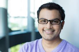 Portrait of Smiling Young Male Professional Sitting in Cafe Stock Image
