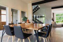 Dining chairs & benches (33)‎. American Walnut Wood Dining Table And Black Leather Sitting Chairs With Ash Wood Legs In The Dining Room Inside A Modern Cube Style Home Quebec Canada Stockphoto