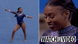 Who is UCLA gymnast Nia Dennis and why is she trending?