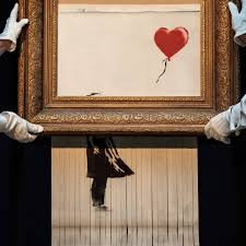 Along with a picture of stunned onlookers as the shredded art emerges from the bottom of the frame. Banksy S Shredded Painting Authenticated As Original Artwork