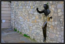 You can see how his lower hand is shiny from all of the tourists taking. Le Passe Muraille Photo Danad Photos At Pbase Com