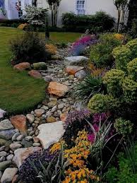 Rock garden designs typically consist of a kaleidoscope of tiny gardens nestling amongst the rocks. 10 Ideas On Making Your Own Dry Creek Bed Backyard Landscaping Designs Backyard Landscaping Rock Garden Landscaping