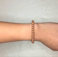 Just short of 1/2 inch. Tan Bracelet Tan Bracelet Tan Tan Color