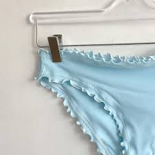 High cut bathing suit in baby blue with tan. Sherris Ruffle Mid Rise Bikini Bottom Baby Blue Azaleas