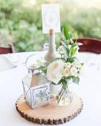 Wedding Centerpieces With Lanterns And Wine Bottles For Winery Weddings So Pretty Wedding Table Centerpieces Lantern Centerpiece Wedding Wedding Table